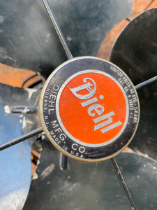 "Image: Antique DIEHL MFG CO. Fan in working condition. Vintage metal fan with intricate grille design, capturing the charm of a bygone era and blending functionality with timeless craftsmanship."