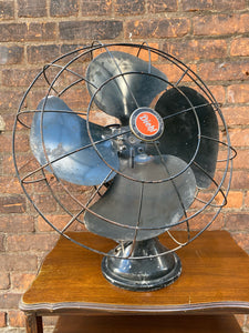 "Image: Antique DIEHL MFG CO. Fan in working condition. Vintage metal fan with intricate grille design, capturing the charm of a bygone era and blending functionality with timeless craftsmanship."