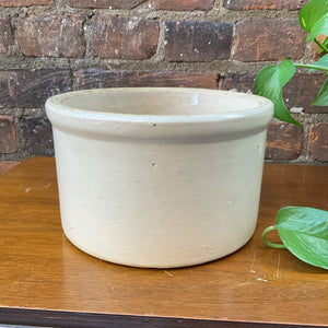 "Image: Antique crock with weathered surface and rustic charm. A piece of history, evoking nostalgia and authenticity. Versatile decor accent for farmhouse aesthetics and vintage collectors."