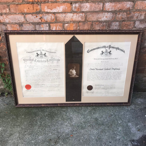 Image: Antique 1915 Teachers Certificate and State Normal School Diploma of Ruth McIntire Rossiter. Two elegant parchment documents with ornate calligraphy and intricate detailing. A testament to academic achievement and dedication to education in a bygone era.