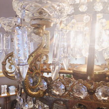 Load image into Gallery viewer, Image: Antique Empire Style Crystal Chandelier - A grand and ornate chandelier with cascading crystals, capturing the opulence of the Empire design era.&quot;