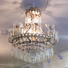 Load image into Gallery viewer, Image: Antique Empire Style Crystal Chandelier - A grand and ornate chandelier with cascading crystals, capturing the opulence of the Empire design era.&quot;