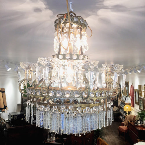 Image: Antique Empire Style Crystal Chandelier - A grand and ornate chandelier with cascading crystals, capturing the opulence of the Empire design era.